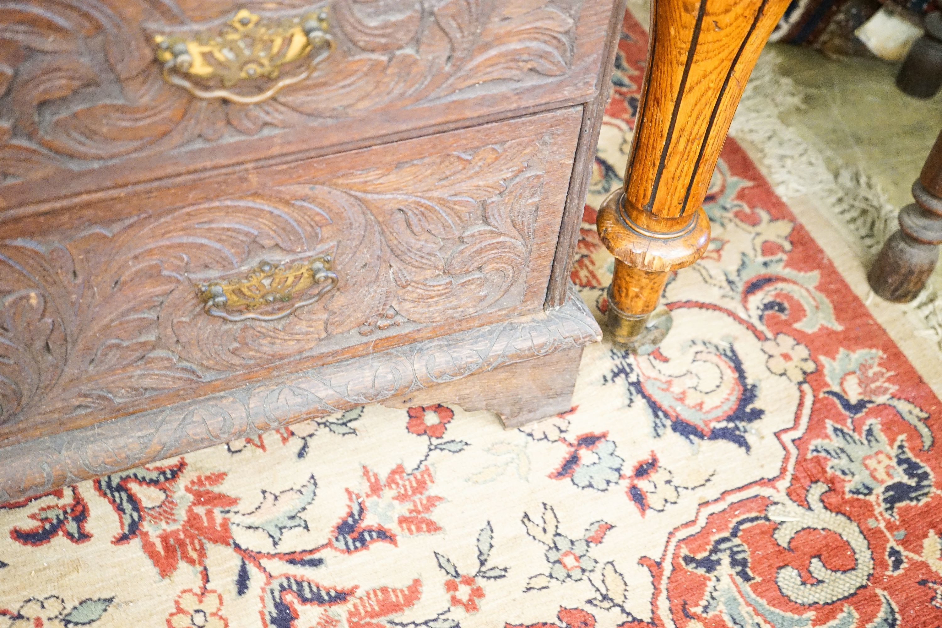 An 18th century later carved oak bureau, width 91cm, depth 53cm, height 101cm